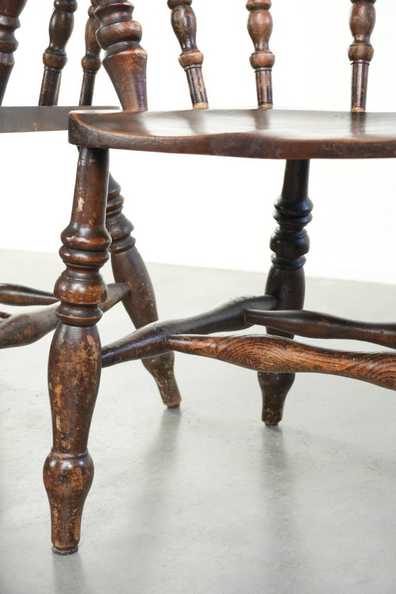 Image 1 of 2x antique English wooden pub/captain chairs from the late 19th century with character and a beautiful color scheme
