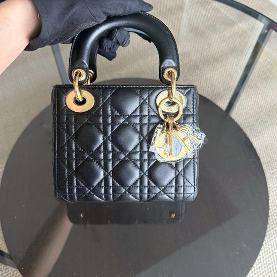 Image 1 of DIOR LADY MINI - PELLE DI AGNELLO CANNAGE, DETTAGLI IN ORO NERO, CINTURINO REGOLABILE