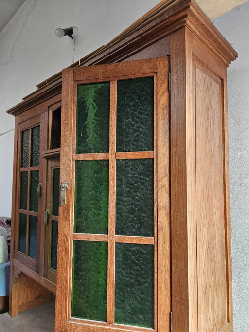Antique cabinet with green glass windows