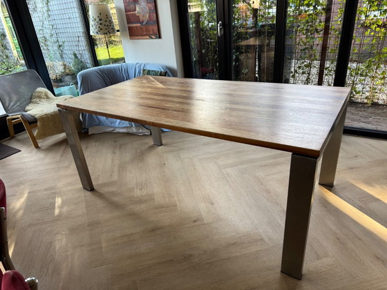Image 1 of Walnut wood table with stainless steel legs