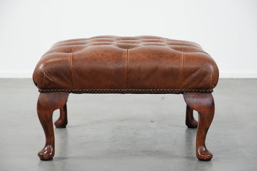 Elegante reposapiés Chesterfield de piel de vacuno