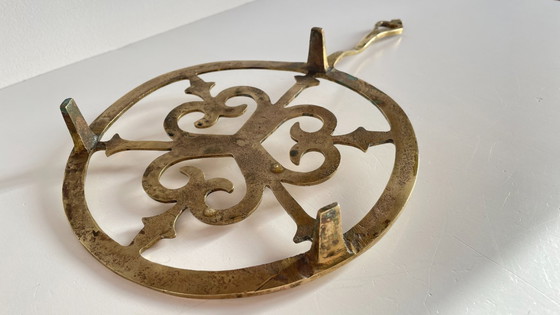 Image 1 of Solid brass trivet