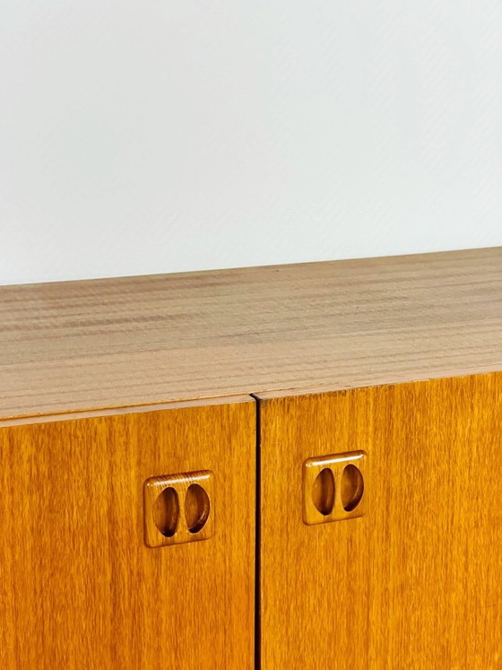 Image 1 of Minimalist Scandinavian sideboard in teak with black metal legs, 1960