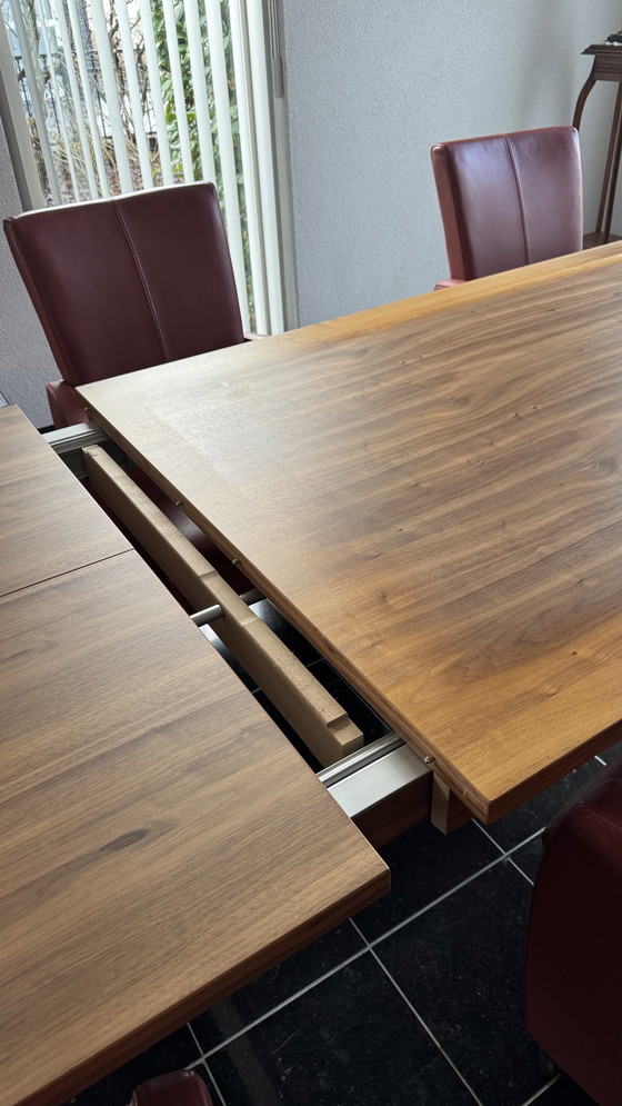 Image 1 of Dining table with 8 leather chairs in my