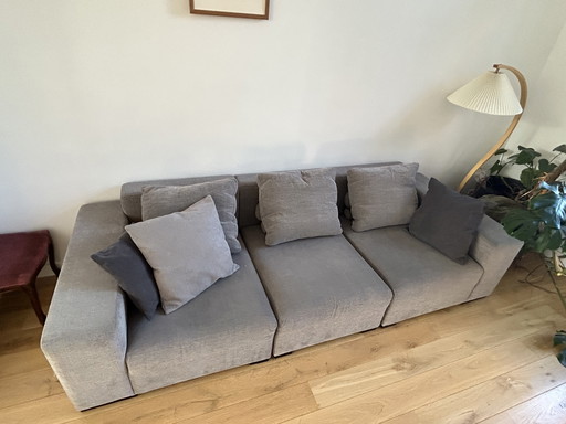 Grijze driezit sofa