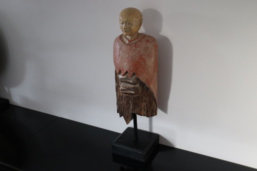 Decorative hand-carved wooden statue of a Monk
