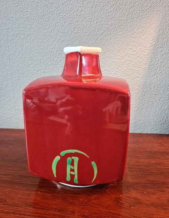 Image 1 of Old Arita porcelain vase in vermilion with the words "flowers, birds, wind and moon".