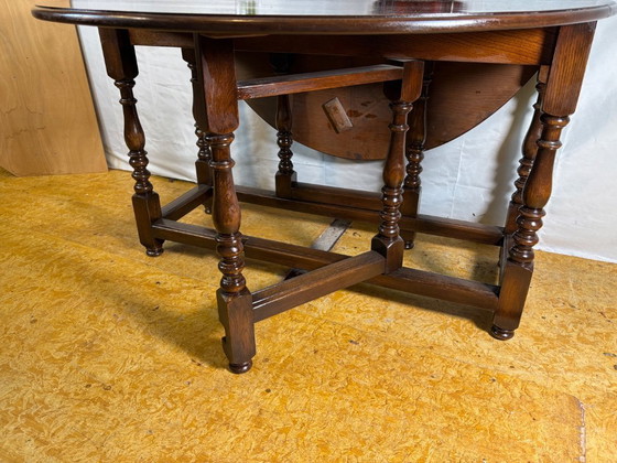 Image 1 of Jacobean Revival massief eiken klaptafel met neerklapbaar blad (circa 1900)