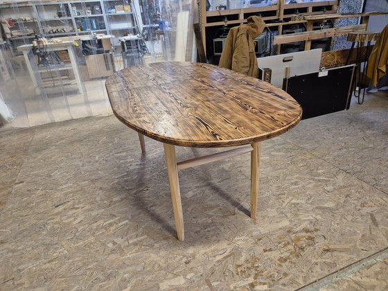 Image 1 of Oval dining table with burnt wood top
