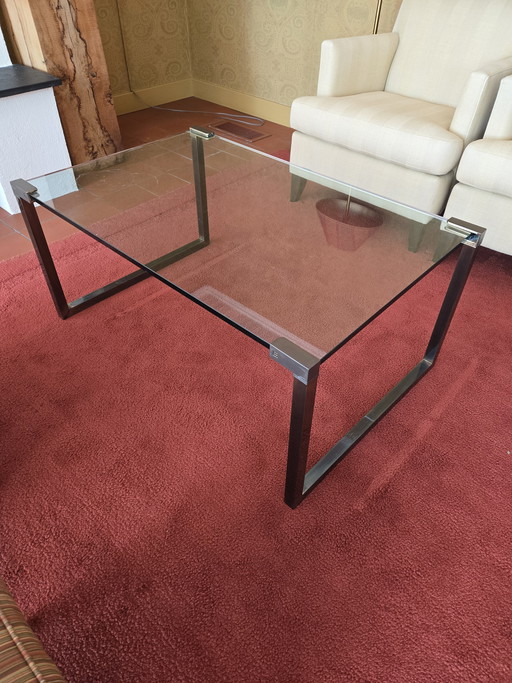 Coffee table made of sturdy glass and a designer metal frame