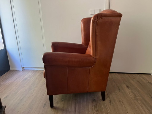 Fauteuil à oreilles en cuir