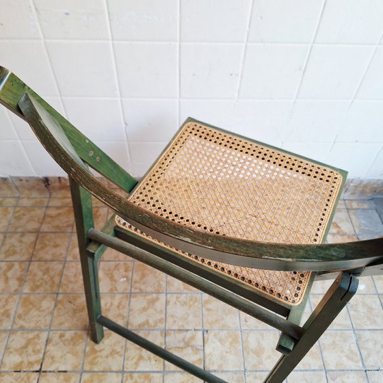 Image 1 of Sedia pieghevole vintage in legno con seduta in rattan
