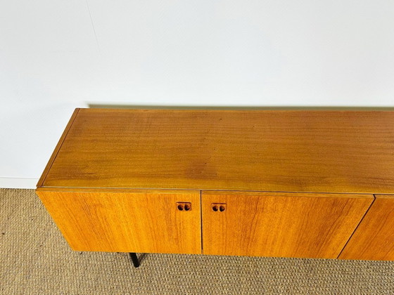 Image 1 of Minimalist Scandinavian sideboard in teak with black metal legs, 1960
