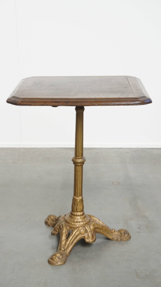 Image 1 of Table de bistrot française ancienne avec pied en fonte dorée et plateau en chêne foncé