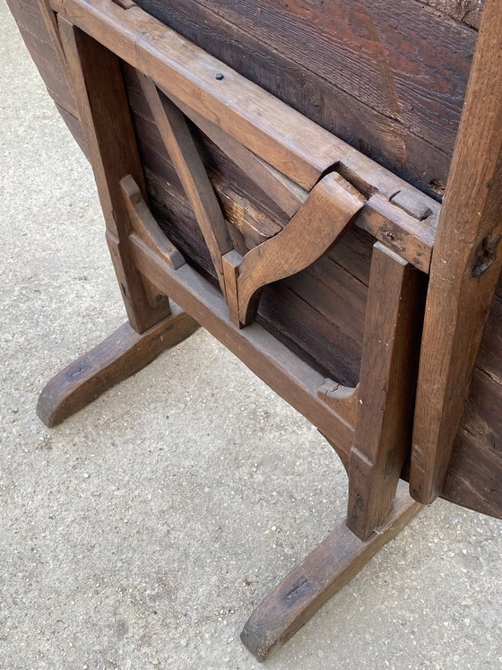 Image 1 of antique folding round winemaker's target table with tilting top