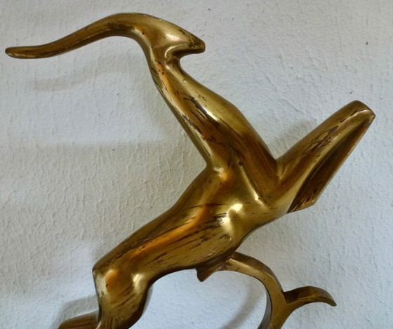 Image 1 of Beautiful brass gazelle on a lacquered wooden base.