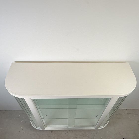 Image 1 of White vintage slatted display case on gold legs