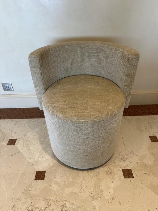 Small round upholstered armchair 