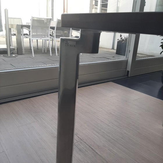 Image 1 of Beautiful Leolux dining table with a solid wooden top and metal legs, complemented by 4 comfortable Artifort dining chairs