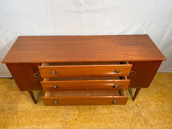 Image 1 of Mid Century Retro Teak Small Sideboard by Schreiber (Circa 1960)  A stylish and compact mid century modern teak sideboard by Sch