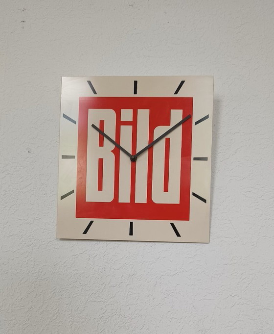 Image 1 of 1970s wall clock with advertising