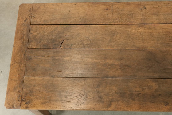 Image 1 of Large antique French farmhouse dining table made of oak from the early 1800s