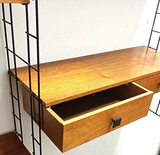 Image 1 of groot vijftiger jaren wandrek met lades en schappen 