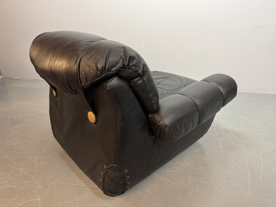 Image 1 of Beautiful Big Black Leather Postmodern Italian Design Space Age Lounge Chair with Brass Buttons and Playful Cord Lacing, 1970s.