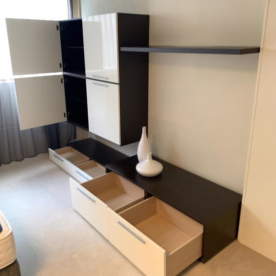 Image 1 of Sleek wall unit with hanging element ALPE