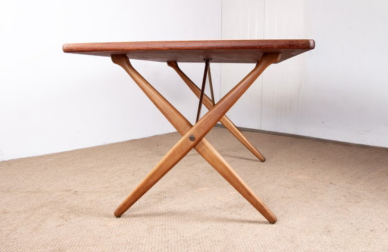 Image 1 of Deense eettafel van massief teak en beukenhout met messing, model AT 303, ontworpen door Hans Wegner voor Andreas Tuck in 1960.