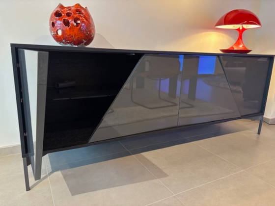 Image 1 of KENDO IS A SIDEBOARD WITH UNUSUAL GEOMETRIC DOORS: EACH ONE HAS A 30° CUT THAT DIVIDES IT INTO TWO PARTS THAT ARE NOT PERFECTLY 