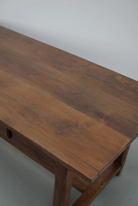 Image 1 of Early 20th-century French rustic country dining table made of oak and elm