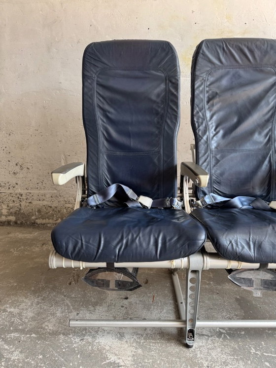 Image 1 of Vintage driepersoons vliegtuigstoelen - Recaro