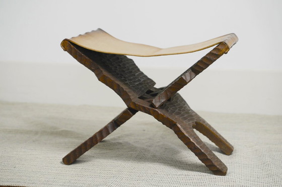 Image 1 of Brutalist Folding Stool Leather Sling Seat Hand Carved Wood X Frame 1950s Rustic Mid Century Ottoman