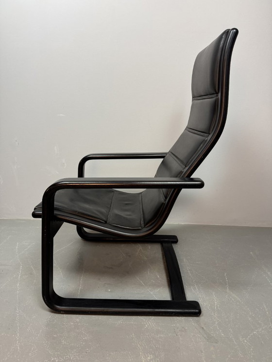 Image 1 of Mid-CenturyDesign Black Leather Lamino Lounge Chair on Black Lacquered Plywood Frame by  Yngve Ekstrom. Denmark, 1970s.