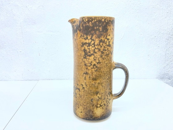 Image 1 of   1 jug and 4 mugs from the 50s 60s by Gotlind Weigel.  Ceramic.  Good used condition. Some chips to the rim
