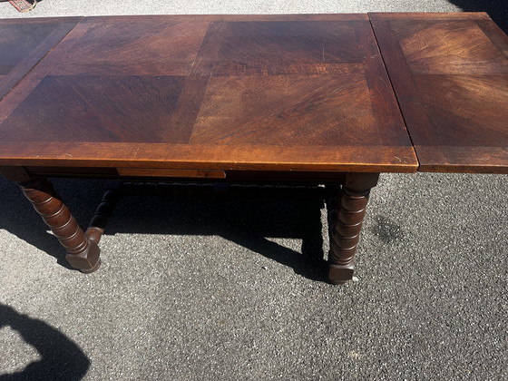 Image 1 of Table en chêne massif à rallonges, pieds tournés XIX e siècle 