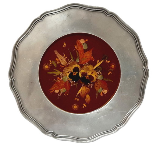 Vintage pewter wall hanging plate with a pressed or dried floral arrangement set in resin