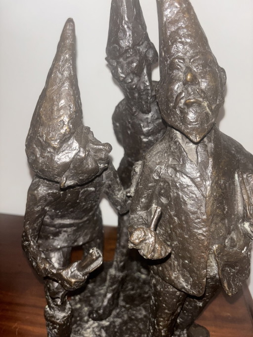 Bronze sculpture of gnomes: Administrator, official, population. Located in park in Made, Netherlands!