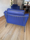 2 sillones Leolux Volare con otomana