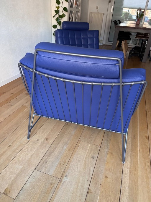 Deux fauteuils Leolux Volare avec repose-pieds