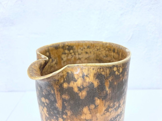 Image 1 of   1 jug and 4 mugs from the 50s 60s by Gotlind Weigel.  Ceramic.  Good used condition. Some chips to the rim