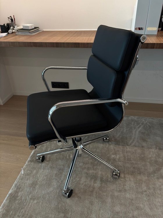 Image 1 of Eames black imitation leather office chair with castors.