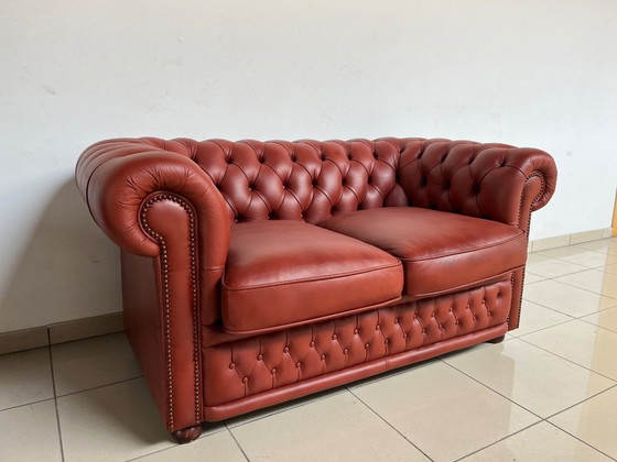 Image 1 of English Chesterfield Sofa Pair – Paprika Red Leather (Fully Restored, Rare Colour)