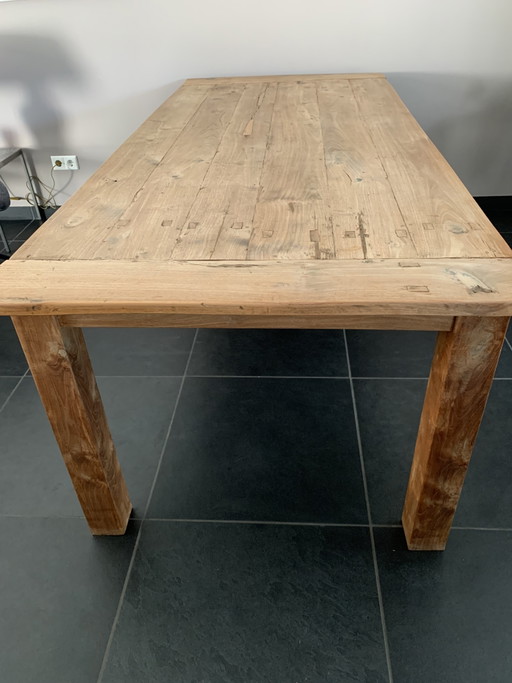 Solid table made of old teak.