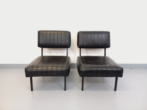 Set of 2 vintage modernist lounge chairs in black imitation leather and metal from the 1960s