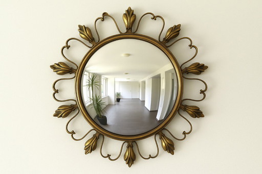 Sun mirror, “Witch’s Eye” in brass, attributed to Maison Deknudt.