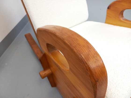 Image 1 of 50's Brutalistische Jean Touret schommelstoel in massief grenen en Bouclette stof