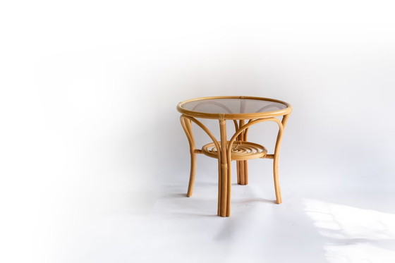 Image 1 of Elegant, round bamboo table with glass top