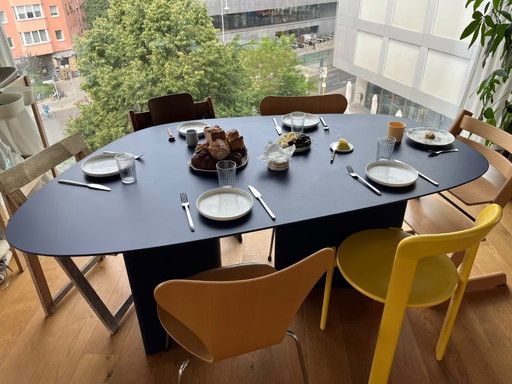 Dining table in organic shape: dark blue